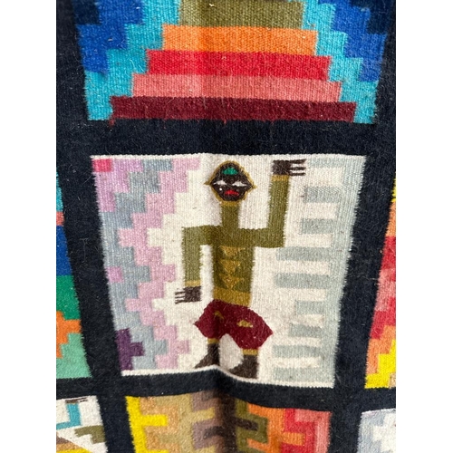 661 - An Aztec style wall hanging on a wooden frame 95cm x 95cm