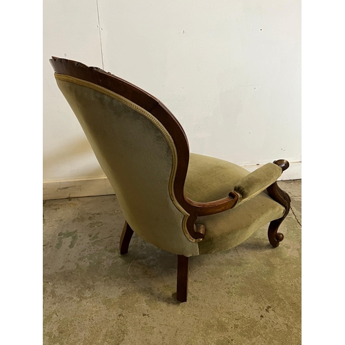 68 - A Victorian open arm chair, spoon button back on cabriole legs