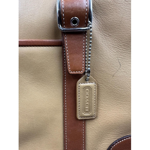 689 - A tan leather coach handbag