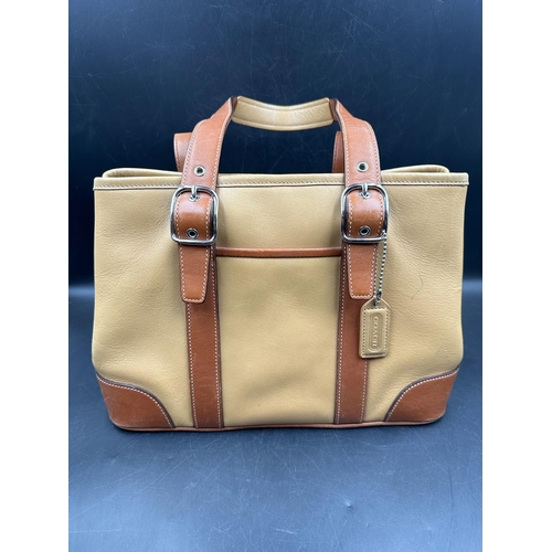 689 - A tan leather coach handbag