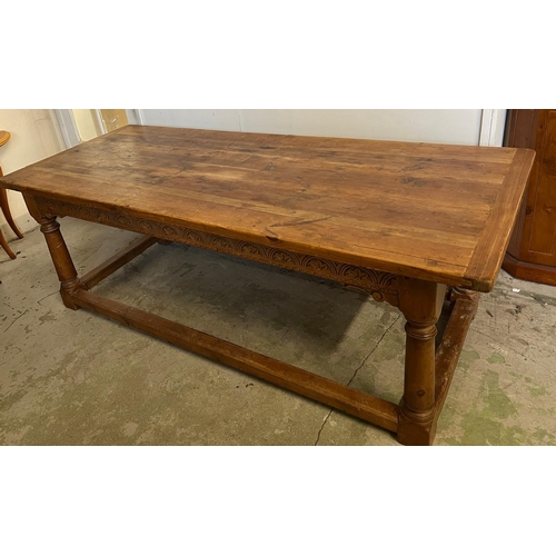 69 - A rustic French style refectory table (H77cm W216cm D89cm)