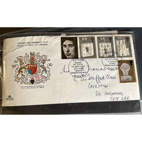 694 - A stamp collection to include three albums of First Day Covers to include many Welsh Rugby, along wi... 