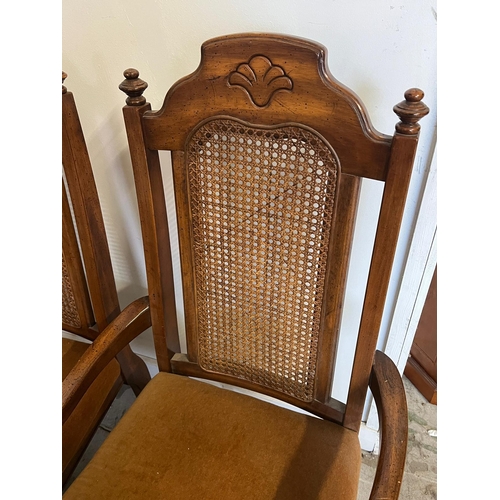 70 - Six chairs and two carvers with cane back and velvet seat pads