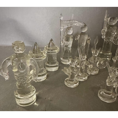 717 - A selection of glass chess pieces, thirty one in total some AF