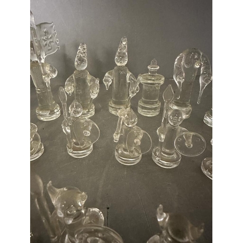 717 - A selection of glass chess pieces, thirty one in total some AF