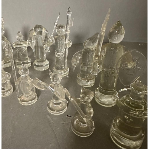 717 - A selection of glass chess pieces, thirty one in total some AF