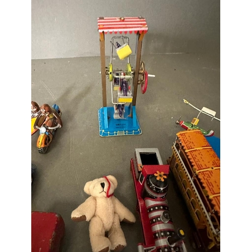 721 - A selection of vintage tin toys and a miniature teddy bear