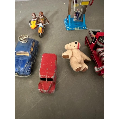 721 - A selection of vintage tin toys and a miniature teddy bear