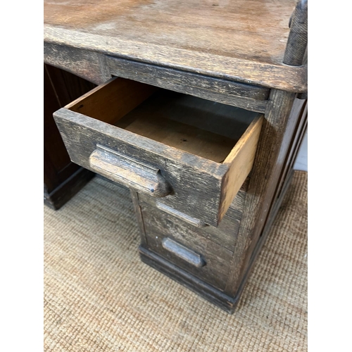 74 - A roll top oak bureau (H118cm W120cm D70cm)