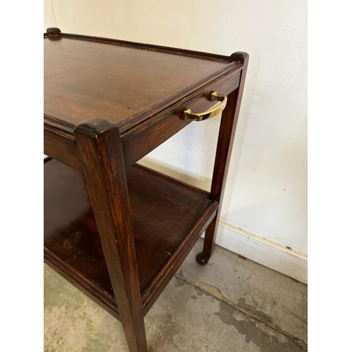 81 - A Mahogany single shelf tea trolley on castors with brass handles to sides (H69cm W60cm D40cm)