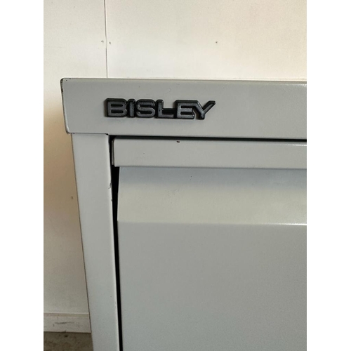 90 - A grey Bisley four drawer office filing cabinet (H134cm W61cm D47cm)