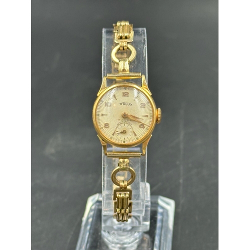 575A - A Wolux 18ct gold ladies watch.