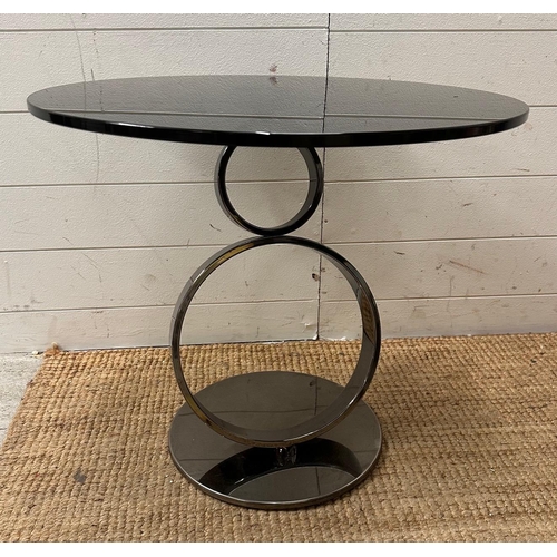 100 - A steel chrome systemic table with black glass (H53cm Dia60cm)