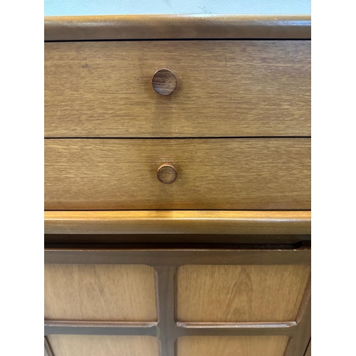 108 - A Mid Century sideboard by Nathan, four short drawers with two cupboard door under (H76cm W122cm 44c... 