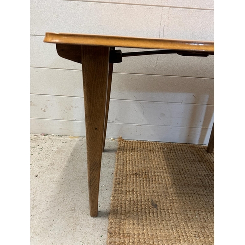 111 - A Mid Century collapsible side table on splayed legs (H50cm W70cm D47cm)