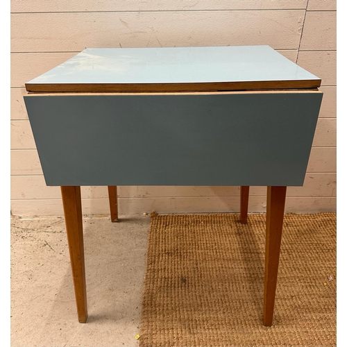 113 - A Mid Century drop leaf kitchen table with pale blue top (H76cm W60cm D51cm)