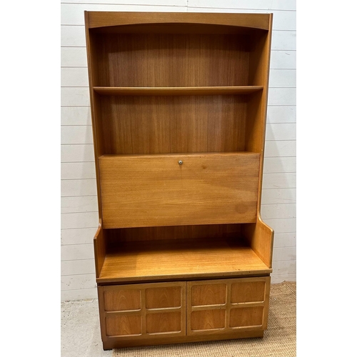 119 - A Mid Century Nathan bookcase bureau with two door cupboard under, fall opening to reveal desk surfa... 