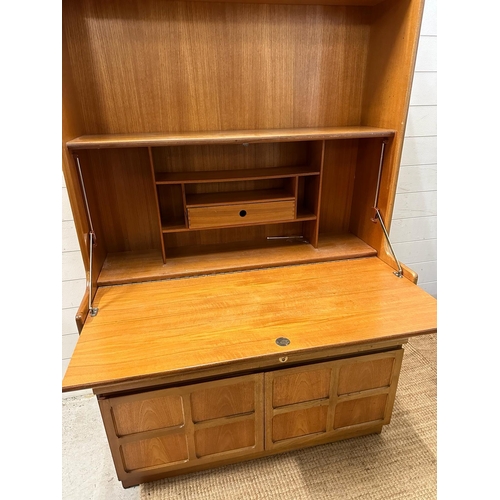 119 - A Mid Century Nathan bookcase bureau with two door cupboard under, fall opening to reveal desk surfa... 