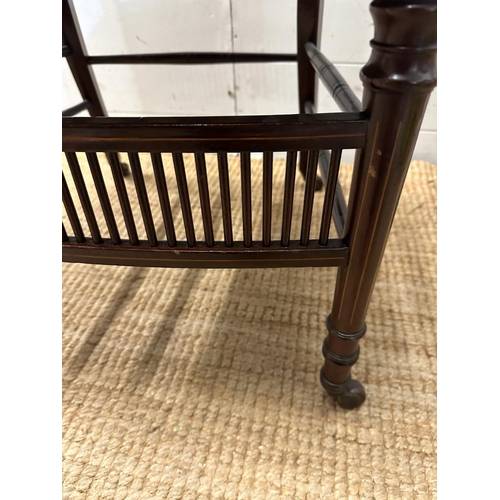 122 - A pair of salon chairs with satinwood inlay on castors.