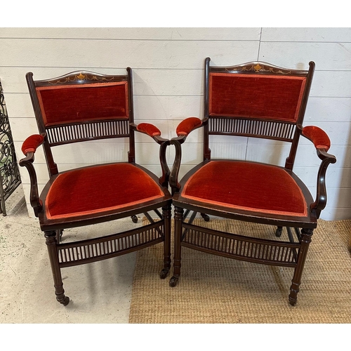 122 - A pair of salon chairs with satinwood inlay on castors.