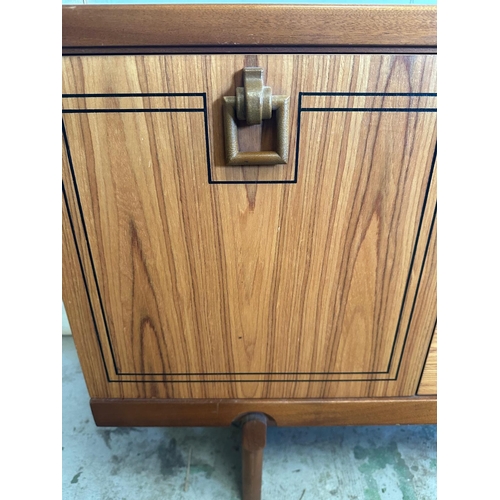 128 - A Mid Century sideboard with string inlay and drop handles (H73cm W184cm D46cm)