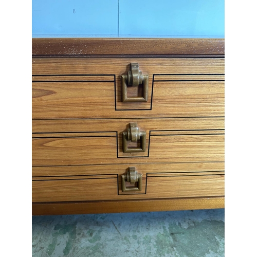 128 - A Mid Century sideboard with string inlay and drop handles (H73cm W184cm D46cm)