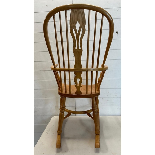 129 - A pine high back Windsor rocking chair