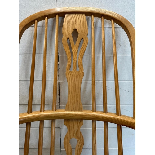 129 - A pine high back Windsor rocking chair