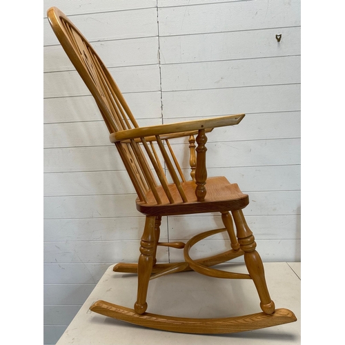 129 - A pine high back Windsor rocking chair