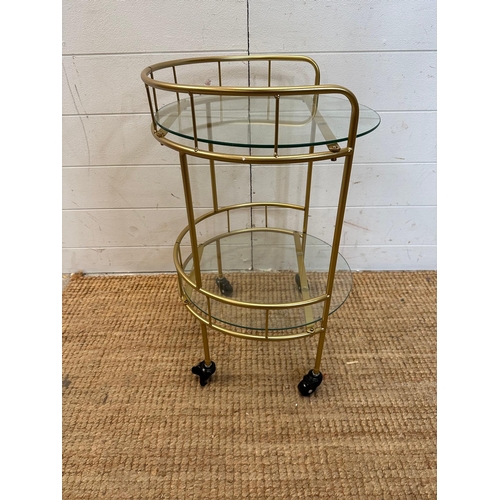 13 - A glass and brass effect drinks trolly with galleried top (H60cm Dia38cm)