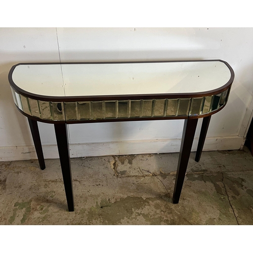 144 - A mirrored console table on tapering legs (H77cm W110cm D35cm)