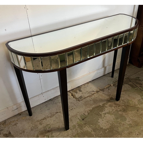 144 - A mirrored console table on tapering legs (H77cm W110cm D35cm)