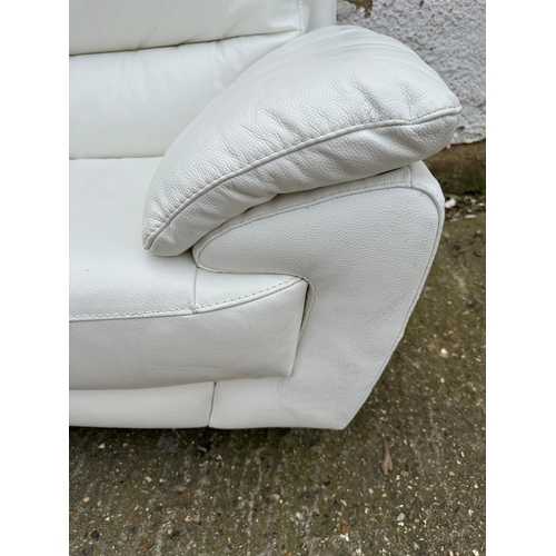 150 - A white leather three seater sofa 212cm x 87cm