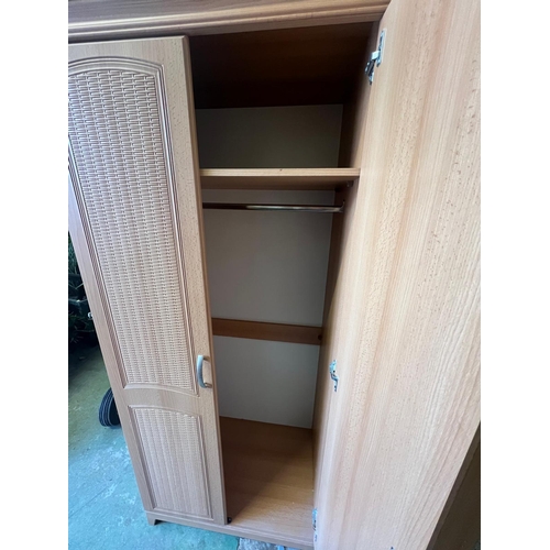 169 - A pine effect bedroom set comprising of two double, one single wardrobe along with a long chest of d... 