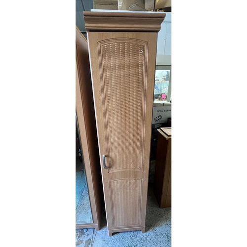 169 - A pine effect bedroom set comprising of two double, one single wardrobe along with a long chest of d... 