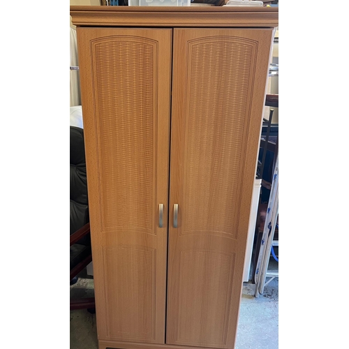 169 - A pine effect bedroom set comprising of two double, one single wardrobe along with a long chest of d... 