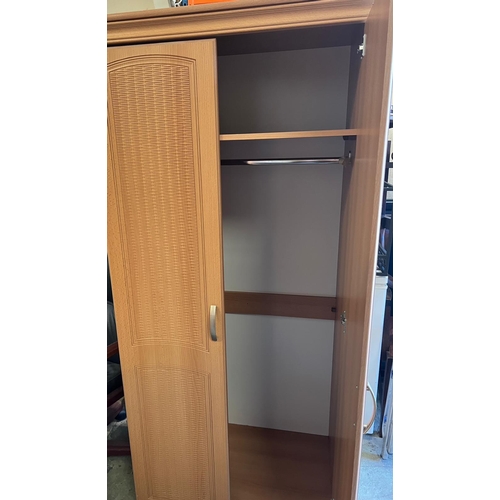 169 - A pine effect bedroom set comprising of two double, one single wardrobe along with a long chest of d... 