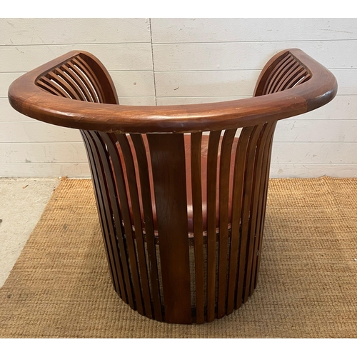 180 - A teak slatted curved round armchair in the style of Hoffman