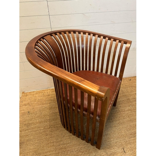 180 - A teak slatted curved round armchair in the style of Hoffman