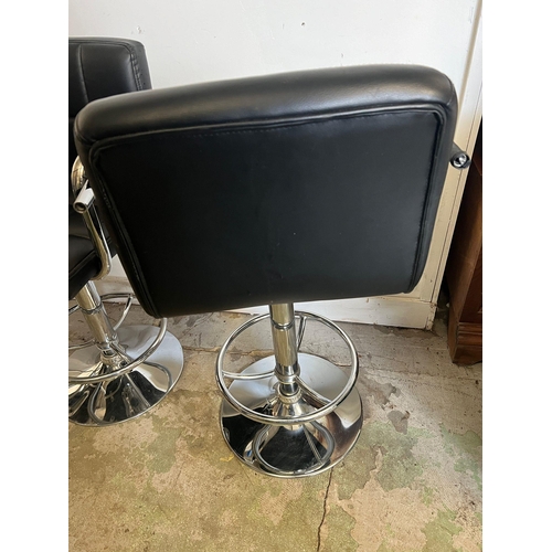 182 - Three bar stools with leatherette exterior adjustable swivel gas lift on chrome base