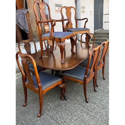 184 - A mahogany dining table with twin pedestal and eight chairs (H75cm W183cm D112cm with three leaves 2... 