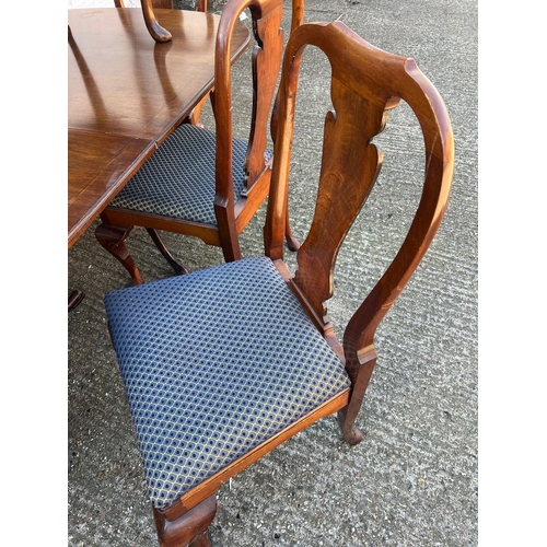 184 - A mahogany dining table with twin pedestal and eight chairs (H75cm W183cm D112cm with three leaves 2... 