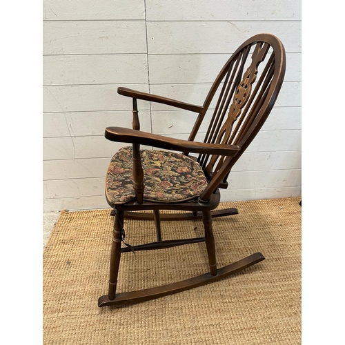 186 - A Mid Century wheel back rocking chair