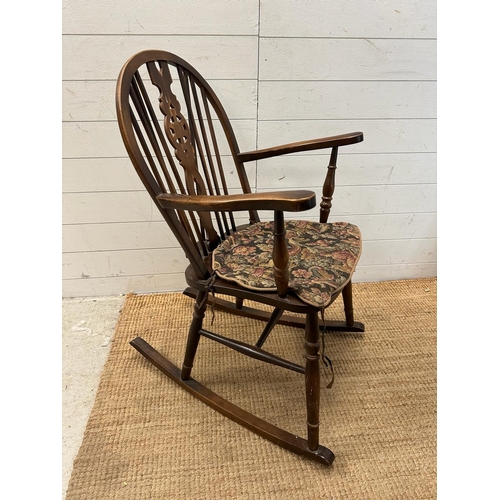 186 - A Mid Century wheel back rocking chair