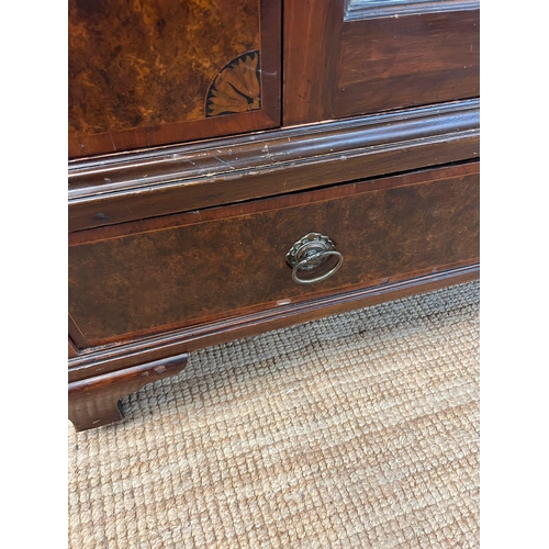 199 - A Victorian mahogany wardrobe with arched hood, the panelled inlaid sides with centre mirrored doors... 