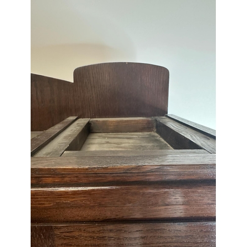 209 - An oak Art Deco cabinet comprising of two drawers four glazed cupboards and central mirror