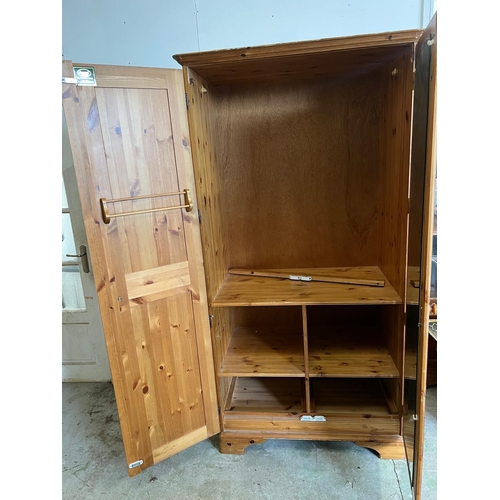 213 - A pine double wardrobe by Ducal (H192cm W98cm D61cm)