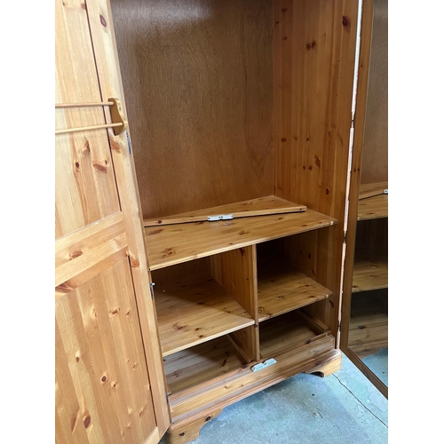 213 - A pine double wardrobe by Ducal (H192cm W98cm D61cm)