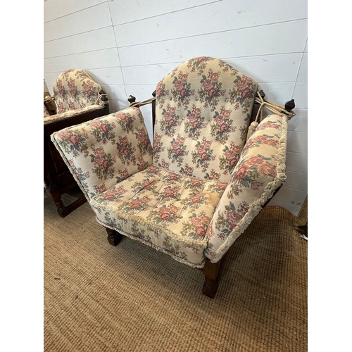 223 - Two linen fold oak chairs with drop sides (H94cm W95cm)