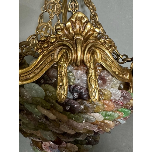 225 - A Murano gilt brass and coloured glass chandelier in pinks, greens and purple.